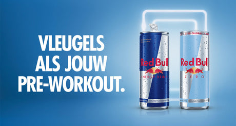 Twee Red Bull blikjes met slogan voor pre-workout.