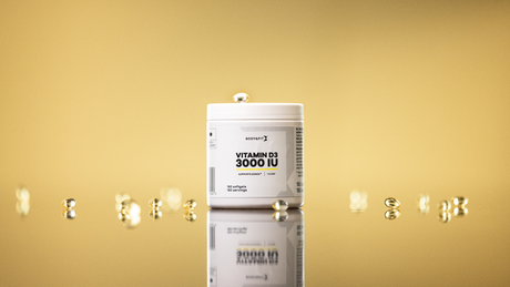 Vitamin D3 3000 IU supplement jar with softgel capsules.